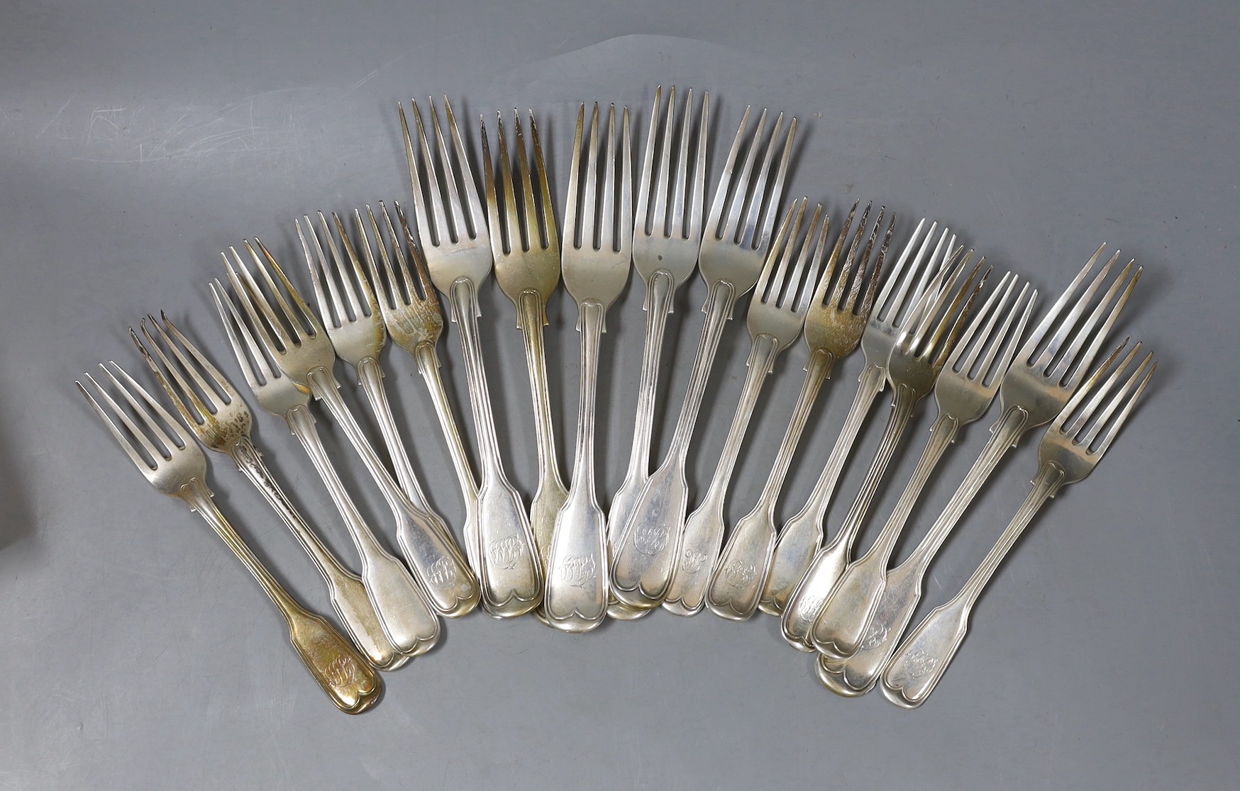 Twelve assorted 19th century silver fiddle and thread pattern dessert forks and six table forks, 36oz.